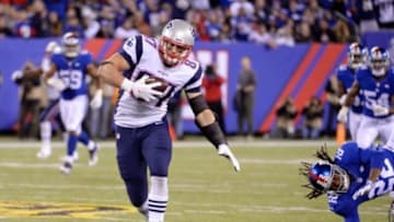 Nov 15, 2015; East Rutherford, NJ, USA; New England Patriots tight end Rob Gronkowski (87) breaks away from New York Giants strong safety Brandon Meriweather (22) to score a touchdown during the game at MetLife Stadium. Mandatory Credit: Robert Deutsch-USA TODAY Sports