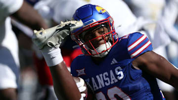 LAWRENCE, KANSAS - OCTOBER 07: Running back Daniel Hishaw Jr. #20 of the Kansas Jayhawks carries the ball during the game against the UCF Knights at David Booth Kansas Memorial Stadium on October 07, 2023 in Lawrence, Kansas. (Photo by Jamie Squire/Getty Images)