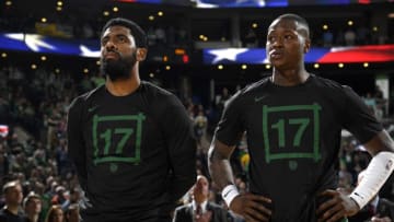 BOSTON, MA - MAY 3: Kyrie Irving #11 and Terry Rozier #12 of the Boston Celtics stand for the National Anthem before Game Three of the Eastern Conference Semifinals against the Milwaukee Bucks during the 2019 NBA Playoffs on May 3, 2019 at the TD Garden in Boston, Massachusetts. NOTE TO USER: User expressly acknowledges and agrees that, by downloading and/or using this photograph, user is consenting to the terms and conditions of the Getty Images License Agreement. Mandatory Copyright Notice: Copyright 2019 NBAE (Photo by Brian Babineau/NBAE via Getty Images)