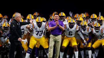 ATLANTA, GEORGIA - DECEMBER 28: Head coach Ed Orgeron of the LSU Tigers and team run onto the to take on the Oklahoma Sooners in the Chick-fil-A Peach Bowl at Mercedes-Benz Stadium on December 28, 2019 in Atlanta, Georgia. (Photo by Kevin C. Cox/Getty Images)