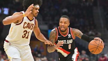 CLEVELAND, OHIO - NOVEMBER 03: Damian Lillard #0 of the Portland Trail Blazers drives against Jarrett Allen #31 of the Cleveland Cavaliers during the first half at Rocket Mortgage Fieldhouse on November 03, 2021 in Cleveland, Ohio. NOTE TO USER: User expressly acknowledges and agrees that, by downloading and/or using this photograph, user is consenting to the terms and conditions of the Getty Images License Agreement. (Photo by Jason Miller/Getty Images)