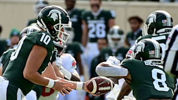 Auburn footballOct 8, 2022; East Lansing, Michigan, USA; Michigan State Spartans quarterback Payton Thorne (10) hands the ball to running back Jalen Berger (8) at Spartan Stadium against Ohio State. Mandatory Credit: Dale Young-USA TODAY Sports
