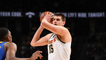 DENVER, CO - JANUARY 15: Nikola Jokic #15 of the Denver Nuggets handles the ball against the Golden State Warriors on January 15, 2019 at the Pepsi Center in Denver, Colorado. NOTE TO USER: User expressly acknowledges and agrees that, by downloading and/or using this Photograph, user is consenting to the terms and conditions of the Getty Images License Agreement. Mandatory Copyright Notice: Copyright 2019 NBAE (Photo by Garrett Ellwood/NBAE via Getty Images)