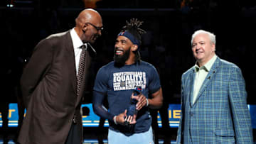 MEMPHIS, TN - FEBRUARY 27: NBA legend Bob Lanier presents the January NBA Cares Community Assist Award to Mike Conley #11 of the Memphis Grizzlies before the game against the Chicago Bulls on February 27, 2019 at FedExForum in Memphis, Tennessee. Copyright 2019 NBAE (Photo by Joe Murphy/NBAE via Getty Images)