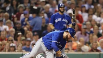 BOSTON, MA - MAY 29: Russell Martin #55 of the Toronto Blue Jays reacts after being struck by a pitch from Rick Porcello #22 of the Boston Red Sox during the seventh inning at Fenway Park on May 29, 2018 in Boston, Massachusetts. (Photo by Maddie Meyer/Getty Images)