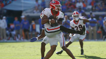 Oct 30, 2021; Jacksonville, Florida, USA; Georgia Bulldogs linebacker Nolan Smith (4) intercepted the ball against the Florida Gators during the first half at TIAA Bank Field. Mandatory Credit: Kim Klement-USA TODAY Sports