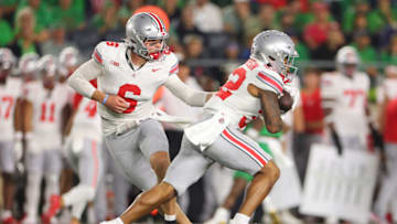 SOUTH BEND, INDIANA - SEPTEMBER 23: Kyle McCord #6 of the Ohio State Buckeyes hands the ball off to TreVeyon Henderson #32 against the Notre Dame Fighting Irish during the first half at Notre Dame Stadium on September 23, 2023 in South Bend, Indiana. (Photo by Michael Reaves/Getty Images)
