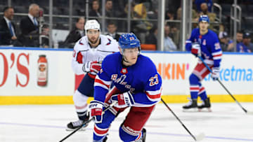 NEW YORK, NEW YORK - NOVEMBER 20: Adam Fox #23 of the New York Rangers controls the puck during their game against the Washington Capitals at Madison Square Garden on November 20, 2019 in New York City. (Photo by Emilee Chinn/Getty Images)