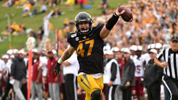 COLUMBIA, MISSOURI - OCTOBER 05: Linebacker Cale Garrett #47 of the Missouri Tigers celebrates as he runs for touchdown after intercepting a pass against the Troy Trojan sin the second quarter at Faurot Field/Memorial Stadium on October 05, 2019 in Columbia, Missouri. (Photo by Ed Zurga/Getty Images)