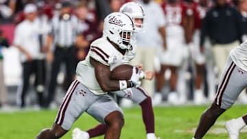 Sep 23, 2023; Columbia, South Carolina, USA; Mississippi State Bulldogs running back Jo'Quavious Marks (7) rushes against the South Carolina Gamecocks in the first quarter at Williams-Brice Stadium. Mandatory Credit: Jeff Blake-USA TODAY Sports