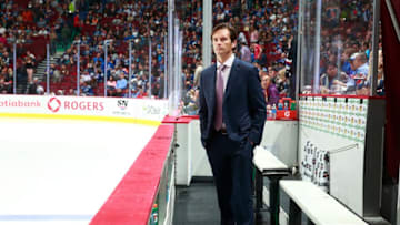 VANCOUVER, BC - OCTOBER 11: Head coach Dallas Eakins of the Edmonton Oilers looks on from the bench during their NHL game against the Vancouver Canucks at Rogers Arena October 11, 2014 in Vancouver, British Columbia, Canada. Vancouver won 5-4 in a shootout. (Photo by Jeff Vinnick/NHLI via Getty Images)