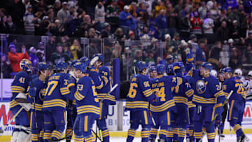 Mar 4, 2022; Buffalo, New York, USA; The Buffalo Sabres celebrate a win against the Minnesota Wild at KeyBank Center. Mandatory Credit: Timothy T. Ludwig-USA TODAY Sports