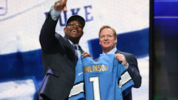 CHICAGO, IL - APRIL 30: Laken Tomlinson of the Duke Blue Devils holds up a jersey with NFL Commissioner Roger Goodell after being picked #28 overall by the Detroit Lions during the first round of the 2015 NFL Draft at the Auditorium Theatre of Roosevelt University on April 30, 2015 in Chicago, Illinois. (Photo by Jonathan Daniel/Getty Images)