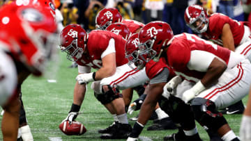 ATLANTA, GEORGIA - DECEMBER 04: Players on the Alabama Crimson Tide line up on the line of scrimmage in the first quarter of the SEC Championship game against the Georgia Bulldogs at Mercedes-Benz Stadium on December 04, 2021 in Atlanta, Georgia. (Photo by Kevin C. Cox/Getty Images)
