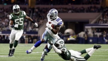 Dec 19, 2015; Arlington, TX, USA; Dallas Cowboys wide receiver Dez Bryant (88) breaks the tackle of New York Jets cornerback Darrelle Revis (24) to score a touchdown in the second quarter at AT&T Stadium. Mandatory Credit: Tim Heitman-USA TODAY Sports