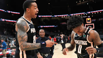 ATLANTA, GA - JANUARY 22: John Collins #20 and Brandon Goodwin #0 of the Atlanta Hawks following their 102-95 win over the Los Angeles Clippers at State Farm Arena on January 22, 2020 in Atlanta, Georgia. NOTE TO USER: User expressly acknowledges and agrees that, by downloading and or using this photograph, User is consenting to the terms and conditions of the Getty Images License Agreement. (Photo by Carmen Mandato/Getty Images)