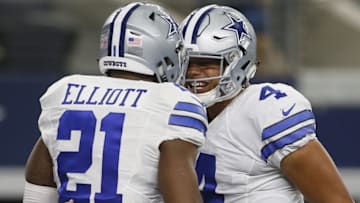 Oct 9, 2016; Arlington, TX, USA; Dallas Cowboys running back Ezekiel Elliott (21) celebrates with quarterback Dak Prescott (4) after scoring a touchdown in the third quarter against the Cincinnati Bengals at AT&T Stadium. Mandatory Credit: Tim Heitman-USA TODAY Sports