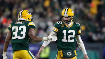 Jan 12, 2020; Green Bay, WI, USA; Green Bay Packers quarterback Aaron Rodgers (12) and running back Aaron Jones (33) celebrate a touchdown against the Seattle Seahawks in the third quarter of a NFC Divisional Round playoff football game at Lambeau Field. Mandatory Credit: Jeff Hanisch-USA TODAY Sports