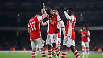 LONDON, ENGLAND - DECEMBER 21: Nicolas Pepe of Arsenal (C) celebrates with teammates Cedric Soares and Eddie Nketiah of Arsenal after scoring their team's second goal during the Carabao Cup Quarter Final match between Arsenal and Sunderland at Emirates Stadium on December 21, 2021 in London, England. (Photo by Julian Finney/Getty Images)