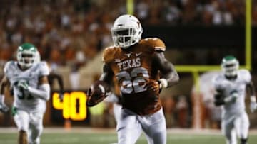 Aug 30, 2014; Austin, TX, USA; Texas Longhorns running back Johnathan Gray (32) runs with the ball during the first half against the North Texas Mean Green at Darrell K Royal-Texas Memorial Stadium. Mandatory Credit: Soobum Im-USA TODAY Sports
