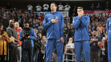 DALLAS, TX - DECEMBER 30: Dirk Nowitzki #41 of the Dallas Mavericks looks on with Luka Doncic #77 of the Dallas Mavericks before the game against the Oklahoma City Thunder on December 30, 2018 at the American Airlines Center in Dallas, Texas. NOTE TO USER: User expressly acknowledges and agrees that, by downloading and or using this photograph, User is consenting to the terms and conditions of the Getty Images License Agreement. Mandatory Copyright Notice: Copyright 2018 NBAE (Photo by Glenn James/NBAE via Getty Images)