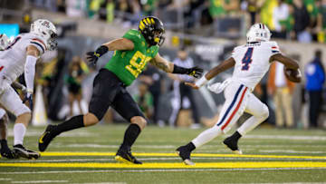 EUGENE, OR - SEPTEMBER 25: Jake Shipley #90 of the Oregon Ducks chases Jordan McCloud #4 of the Arizona Wildcats at Autzen Stadium on September 25, 2021 in Eugene, Oregon. (Photo by Tom Hauck/Getty Images)