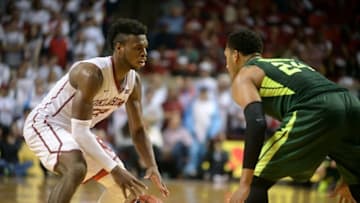 Mar 1, 2016; Norman, OK, USA; Oklahoma Sooners guard Buddy Hield (24) handles the ball against Baylor Bears guard Ishmail Wainright (24) during the second halt at Lloyd Noble Center. Mandatory Credit: Mark D. Smith-USA TODAY Sports