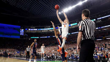 MINNEAPOLIS, MINNESOTA - APRIL 06: Kyle Guy #5 of the Virginia Cavaliers attempts a game-winning three point basket as he is fouled by Samir Doughty #10 of the Auburn Tigers in the second half during the 2019 NCAA Final Four semifinal at U.S. Bank Stadium on April 6, 2019 in Minneapolis, Minnesota. (Photo by Streeter Lecka/Getty Images)