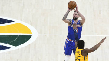 SALT LAKE CITY, UT - JANUARY 26: Austin Rivers #8 of the New York Knicks shoots over Donovan Mitchell #45 of the Utah Jazz during a game at Vivint Smart Home Arena on January 26, 2021 in Salt Lake City, Utah. NOTE TO USER: User expressly acknowledges and agrees that, by downloading and/or using this photograph, user is consenting to the terms and conditions of the Getty Images License Agreement. (Photo by Alex Goodlett/Getty Images)