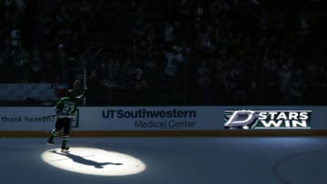 Dec 17, 2016; Dallas, TX, USA; Dallas Stars right wing Adam Cracknell (27) tosses a puck into the stands after the game against the Philadelphia Flyers at American Airlines Center. Stars won 3-1. Mandatory Credit: Tim Heitman-USA TODAY Sports