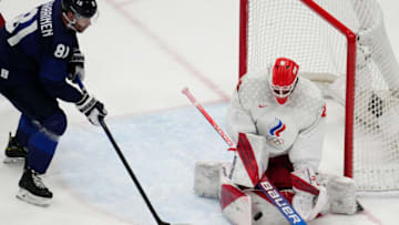 Feb 20, 2022; Beijing, China; Team ROC goalkeeper Ivan Fedotov (28) makes a save in front of Team Finland forward Iiro Pakarinen (81) in the third period during the Beijing 2022 Olympic Winter Games at National Indoor Stadium. Mandatory Credit: George Walker IV-USA TODAY Sports