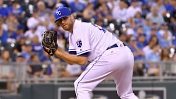 Jul 27, 2016; Kansas City, MO, USA; Kansas City Royals relief pitcher Wade Davis (17) checks a runner at first base in the ninth inning against the Los Angeles Angels at Kauffman Stadium. The Royals won 7-5. Mandatory Credit: Denny Medley-USA TODAY Sports
