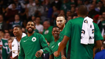 BOSTON, MA - OCTOBER 30: Kyrie Irving #11 of the Boston Celtics and team mates react on the bench during the second half of the game against the San Antonio Spurs at TD Garden on October 30, 2017 in Boston, Massachusetts. NOTE TO USER: User expressly acknowledges and agrees that, by downloading and or using this photograph, User is consenting to the terms and conditions of the Getty Images License Agreement. (Photo by Omar Rawlings/Getty Images)