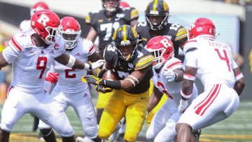 IOWA CITY, IOWA- SEPTEMBER 7: Wide receiver Tyrone Tracy #3 of the Iowa Hawkeyes rushes up field during the second half against linebacker Tyreek Maddox-Williams #9, defensive back Avery Young #2, linebacker Olakunle Fatukasi #3 and defensive back Tim Barrow #4 of the Rutgers Scarlet Knights on September 7, 2019 at Kinnick Stadium in Iowa City, Iowa. (Photo by Matthew Holst/Getty Images)