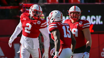 Caleb Tannor #2 of the Nebraska Cornhuskers celebrates a stop with linebacker Ernest Hausmann (Photo by Steven Branscombe/Getty Images)