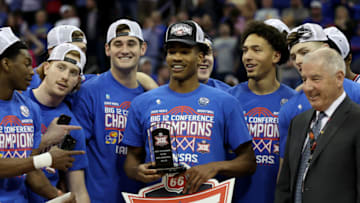 Ochai Agbaji is presented with the Big 12 Conference Tournament MVP trophy. Getty Images.
