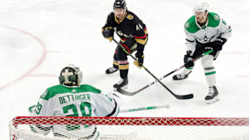 LAS VEGAS, NEVADA - JANUARY 16: Jonas Rondbjerg #46 of the Vegas Golden Knights and Colin Miller #6 of the Dallas Stars look for a rebound after Jake Oettinger #29 of the Dallas Stars blocked a shot in the first period of their game at T-Mobile Arena on January 16, 2023 in Las Vegas, Nevada. The Stars defeated the Golden Knights 4-0. (Photo by Ethan Miller/Getty Images)