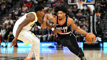 SALT LAKE CITY, UTAH - OCTOBER 14: Shaedon Sharpe #17 of the Portland Trail Blazers drives into Ochai Agbaji #30 of the Utah Jazz during the second half of a preseason NBA game at Delta Center on October 14, 2023 in Salt Lake City, Utah. NOTE TO USER: User expressly acknowledges and agrees that, by downloading and or using this photograph, User is consenting to the terms and conditions of the Getty Images License Agreement. (Photo by Alex Goodlett/Getty Images)