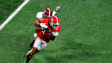 ATLANTA, GA - JANUARY 08: Terry Godwin #5 of the Georgia Bulldogs is tackled by Minkah Fitzpatrick #29 of the Alabama Crimson Tide after a catch during teh first quarter in the CFP National Championship presented by AT&T at Mercedes-Benz Stadium on January 8, 2018 in Atlanta, Georgia. (Photo by Scott Cunningham/Getty Images)