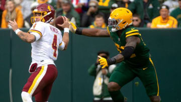 Green Bay Packers guard Rashan Gary (52) attempts to sack Washington Football Team quarterback Taylor Heinicke (4) in the third quarter, Sunday, Oct. 24, 2021, at Lambeau Field in Green Bay, Wis.Gpg Packer Vs Washington 102421 0009