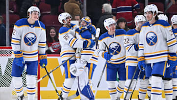 MONTREAL, CANADA - NOVEMBER 22: Alex Tuch #89 of the Buffalo Sabres hugs it out with goaltender Craig Anderson #41 after their victory against the Montreal Canadiens at Centre Bell on November 22, 2022 in Montreal, Quebec, Canada. The Buffalo Sabres defeated the Montreal Canadiens 7-2. (Photo by Minas Panagiotakis/Getty Images)