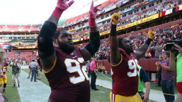 Oct 16, 2016; Landover, MD, USA; Washington Redskins defensive end Chris Baker (92) and Redskins defensive end Ricky Jean Francois (99) celebrate while leaving the field after their game against the Philadelphia Eagles at FedEx Field. The Redskins won 27-20. Mandatory Credit: Geoff Burke-USA TODAY Sports