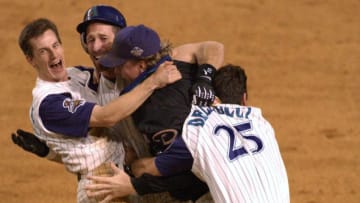 4 Nov 2001: Craig Counsell #4, Luis Gonzalez #20, Curt Schilling #38 and David Dellucci #36 of the Arizona Diamondbacks celebrate defeating the New York Yankees to win game seven of the Major League Baseball World Series at Bank One Ballpark in Phoenix, Arizona. DIGITAL IMAGE. Mandatory Credit: Matthew Stockman/ALLSPORT