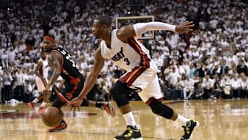 May 9, 2016; Miami, FL, USA; Miami Heat guard Dwyane Wade (3) drives to the basket as Toronto Raptors forward Terrence Ross (31) looks on during the fourth quarter in game four of the second round of the NBA Playoffs at American Airlines Arena. The Heat won in overtime 94-87. Mandatory Credit: Steve Mitchell-USA TODAY Sports