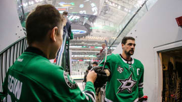 DALLAS, TX - OCTOBER 17: Dallas Stars left wing Jamie Benn (14) fist bumps a fan after warm-ups before the game between the Dallas Stars and the Arizona Coyotes on October 17, 2017 at the American Airlines Center in Dallas, Texas. Dallas defeats Arizona 3-1. (Photo by Matthew Pearce/Icon Sportswire via Getty Images)