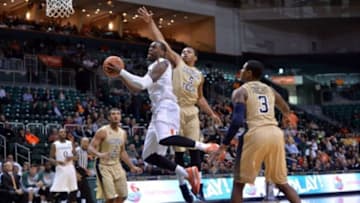 Jan 28, 2015; Coral Gables, FL, USA; Miami Hurricanes guard Sheldon McClellan (10) drives to the basket as Georgia Tech Yellow Jackets guard Corey Heyward (5) defends the play during the second half at BankUnited Center. Mandatory Credit: Steve Mitchell-USA TODAY Sports