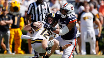 Auburn footballSep 24, 2022; Auburn, Alabama, USA; Missouri Tigers quarterback Brady Cook (12) is sacked by Auburn Tigers linebacker Eku Leota (55) during the fourth quarter at Jordan-Hare Stadium. Mandatory Credit: John Reed-USA TODAY Sports