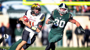 Nov 14, 2015; East Lansing, MI, USA; Michigan State Spartans linebacker Riley Bullough (30) chases Maryland Terrapins quarterback Perry Hills (11) out of the pocket during the 2nd half of a game at Spartan Stadium. Mandatory Credit: Mike Carter-USA TODAY Sports