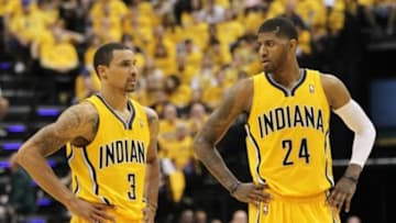 May 3, 2014; Indianapolis, IN, USA; Indiana Pacers guard George Hill (3) and Indiana Pacers forward Paul George (24) talk during the third quarter against the Atlanta Hawks in game seven of the first round of the 2014 NBA Playoffs at Bankers Life Fieldhouse.Indiana won 92-80. Mandatory Credit: Pat Lovell-USA TODAY Sports