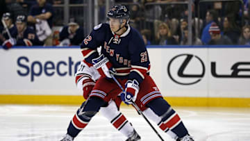 Dec 3, 2016; New York, NY, USA; New York Rangers defenseman Nick Holden (22) controls the puck against the Carolina Hurricanes during the third period at Madison Square Garden. Mandatory Credit: Adam Hunger-USA TODAY Sports